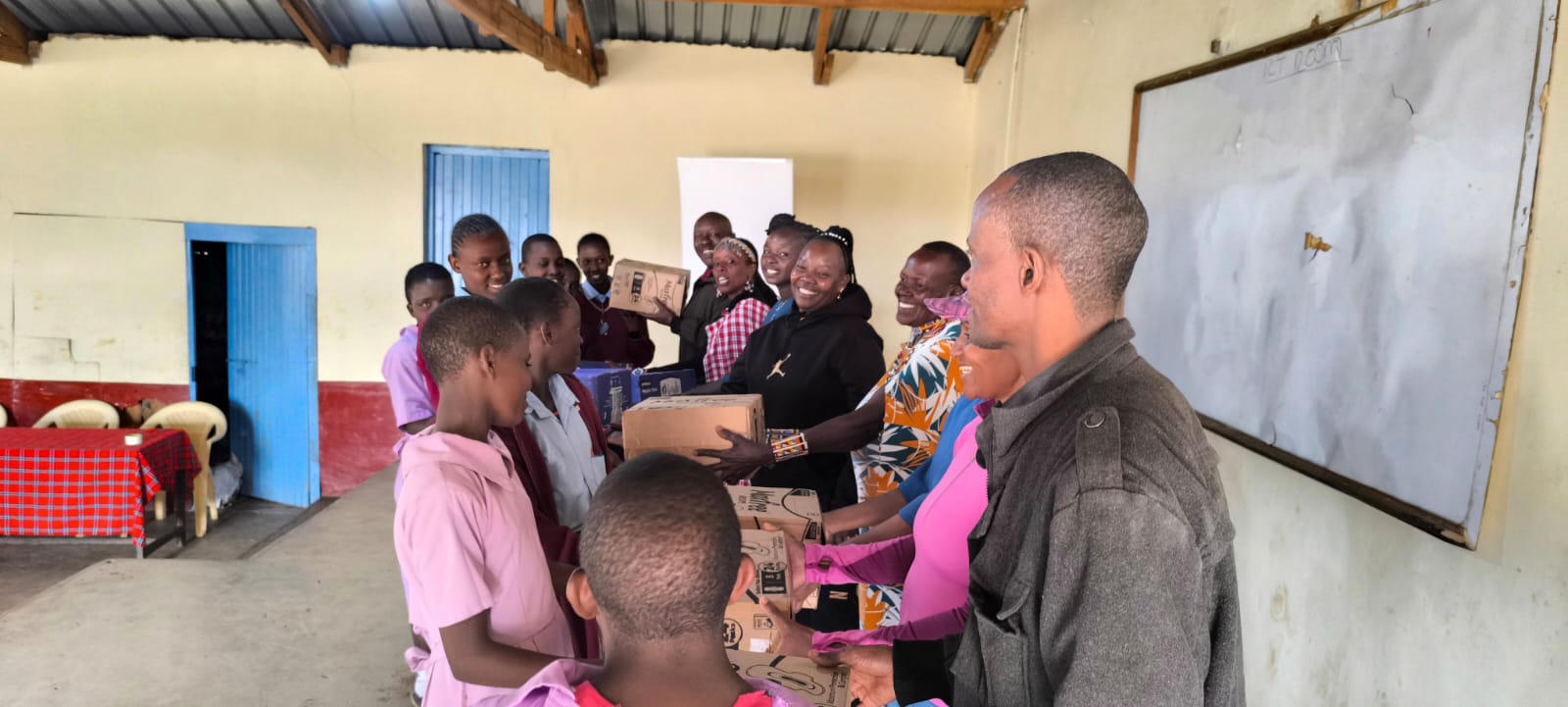 Community members collecting sanitary pads