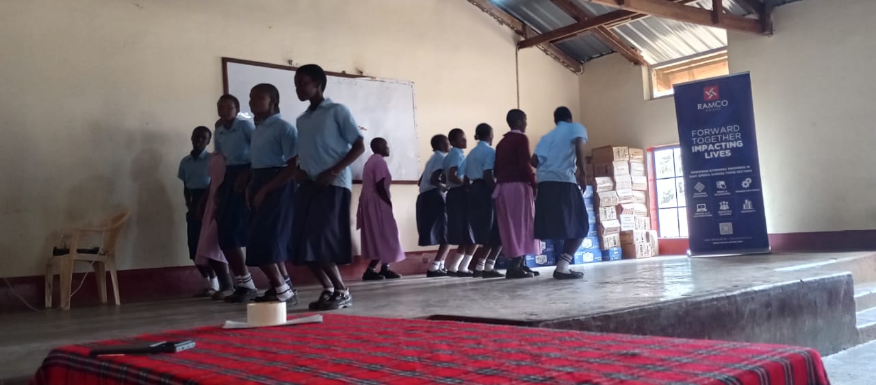 Girls receiving educational materials